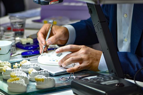 Dental technician working on a crown